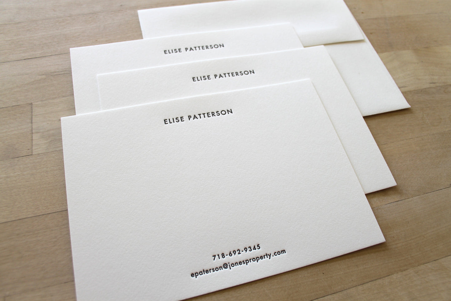 Clean centered Futura type letterpress impression on premium cotton notecard