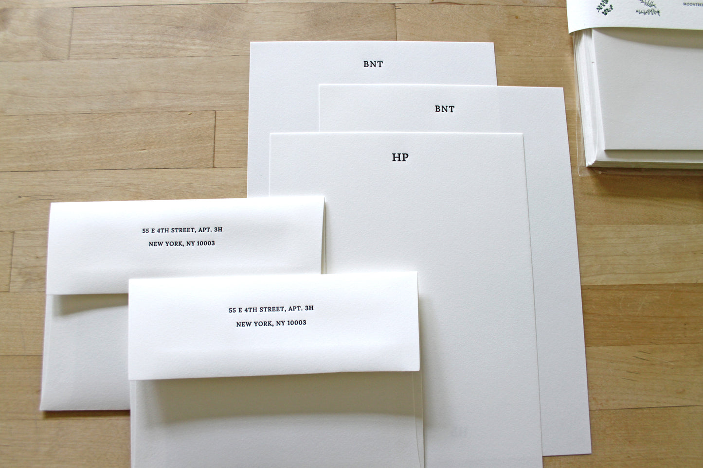 Custom letterpress letter sheet set showing initials options and matching envelopes