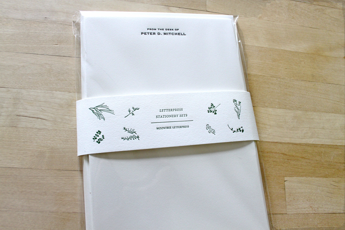 Personalized letterpress letter sheet set packaged in clear sleeve with letterpress band