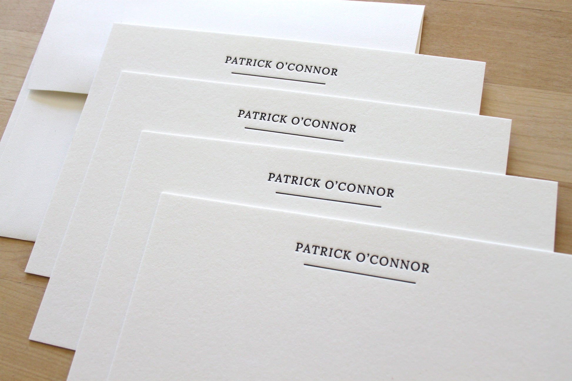 Crisp letterpress stationery with matching envelopes for professional correspondence