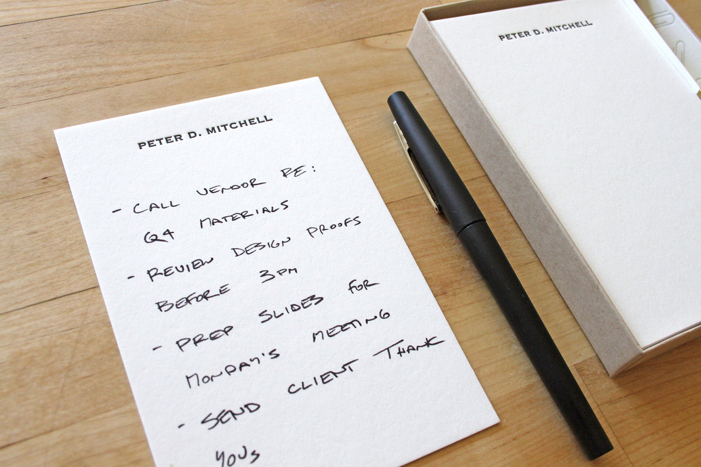 Personalized letterpress jotter notes in elegant kraft box packaging with gold paperclips, custom desk stationery