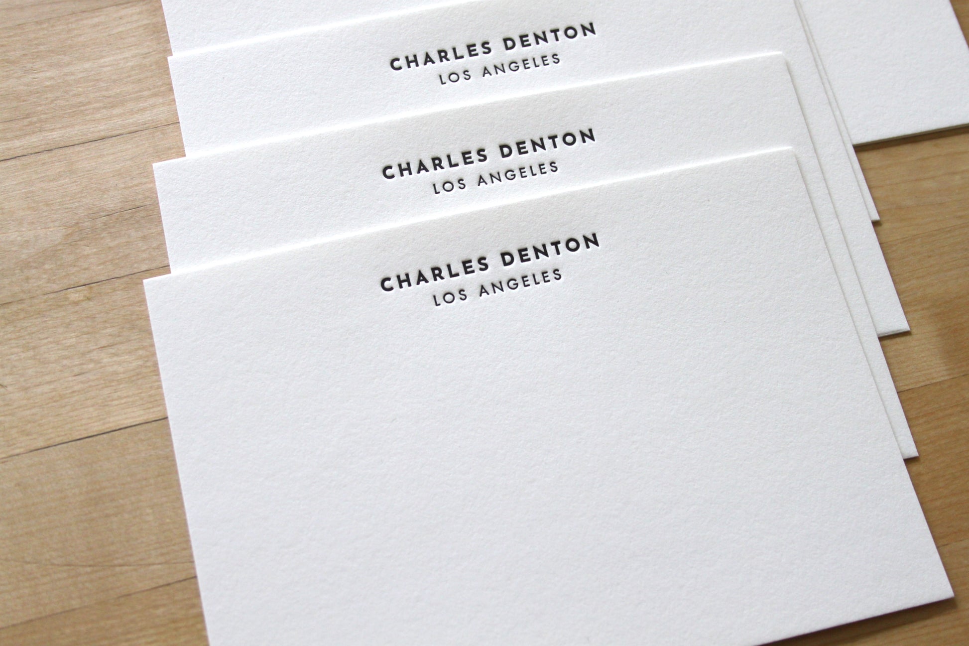 Personalized letterpress stationery with bold name headline and matching return-addressed envelope