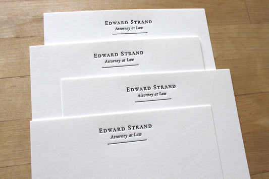 Name + Title letterpress notecards centered layout for attorney, classic serif name with italic title and rule line, professional correspondence cards on cotton paper