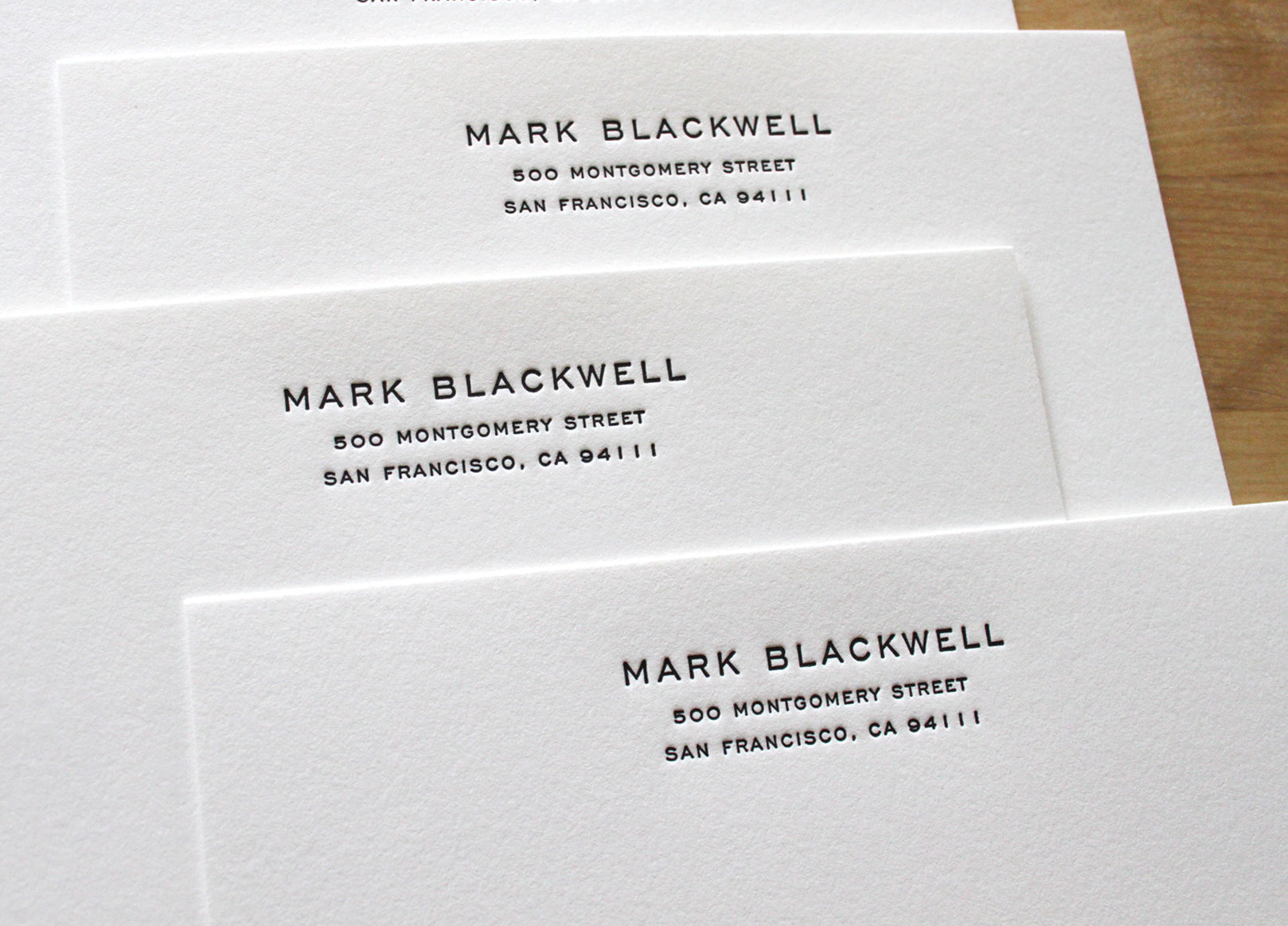 Stack of personalized engravers address letterpress business notecards on cotton paper