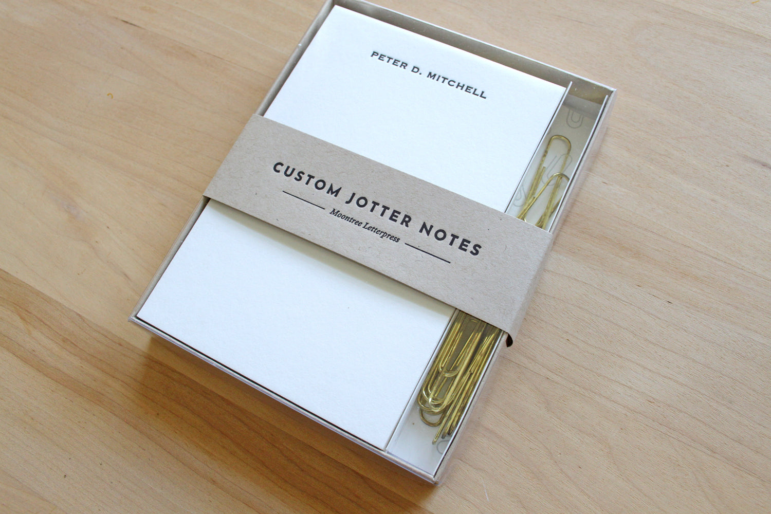 Personalized letterpress jotter notes printed on cotton paper with brass paperclips, ideal for professionals