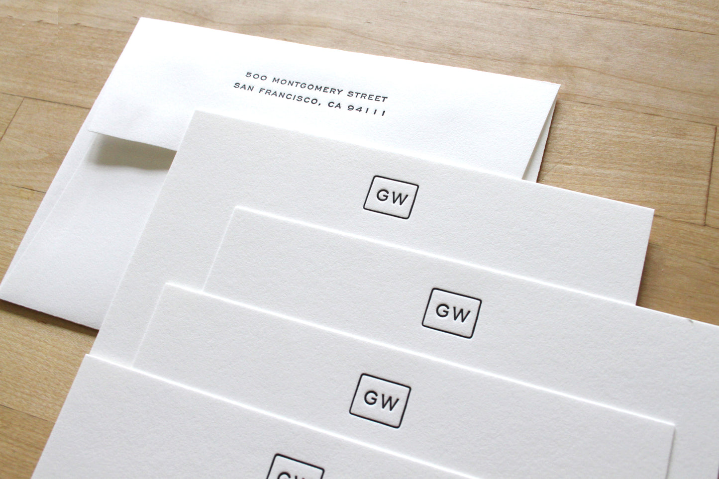 Bound Initials letterpress notecards with boxed initials at top and contact details at bottom left, personalized cotton paper professional stationery