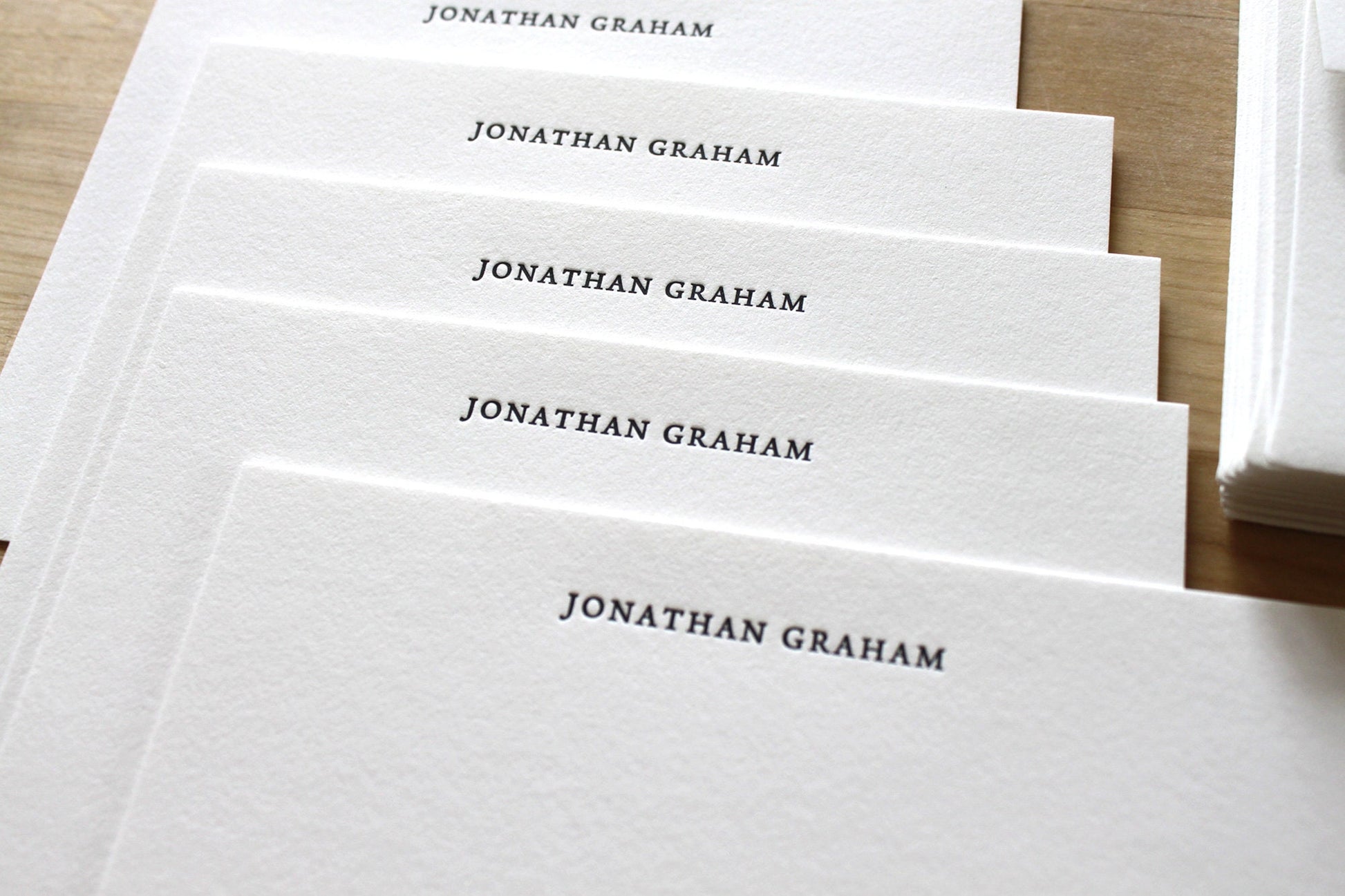 Stack of traditional style letterpress statiomery with matching envelope