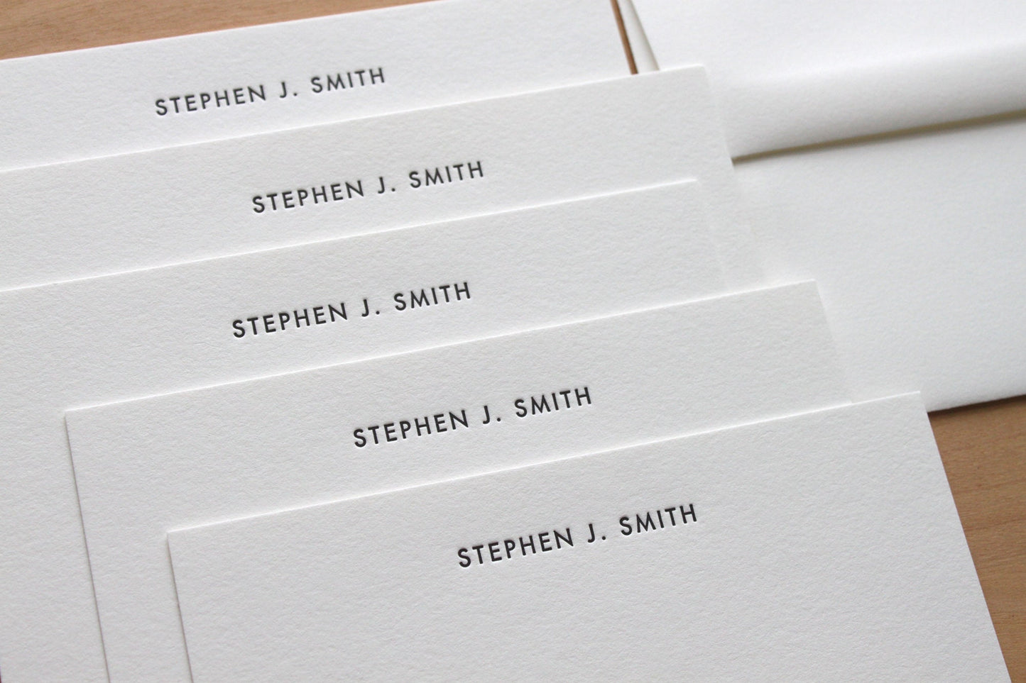 Close up of Futura letterpress notecard showing deep impression on heavyweight cotton paper