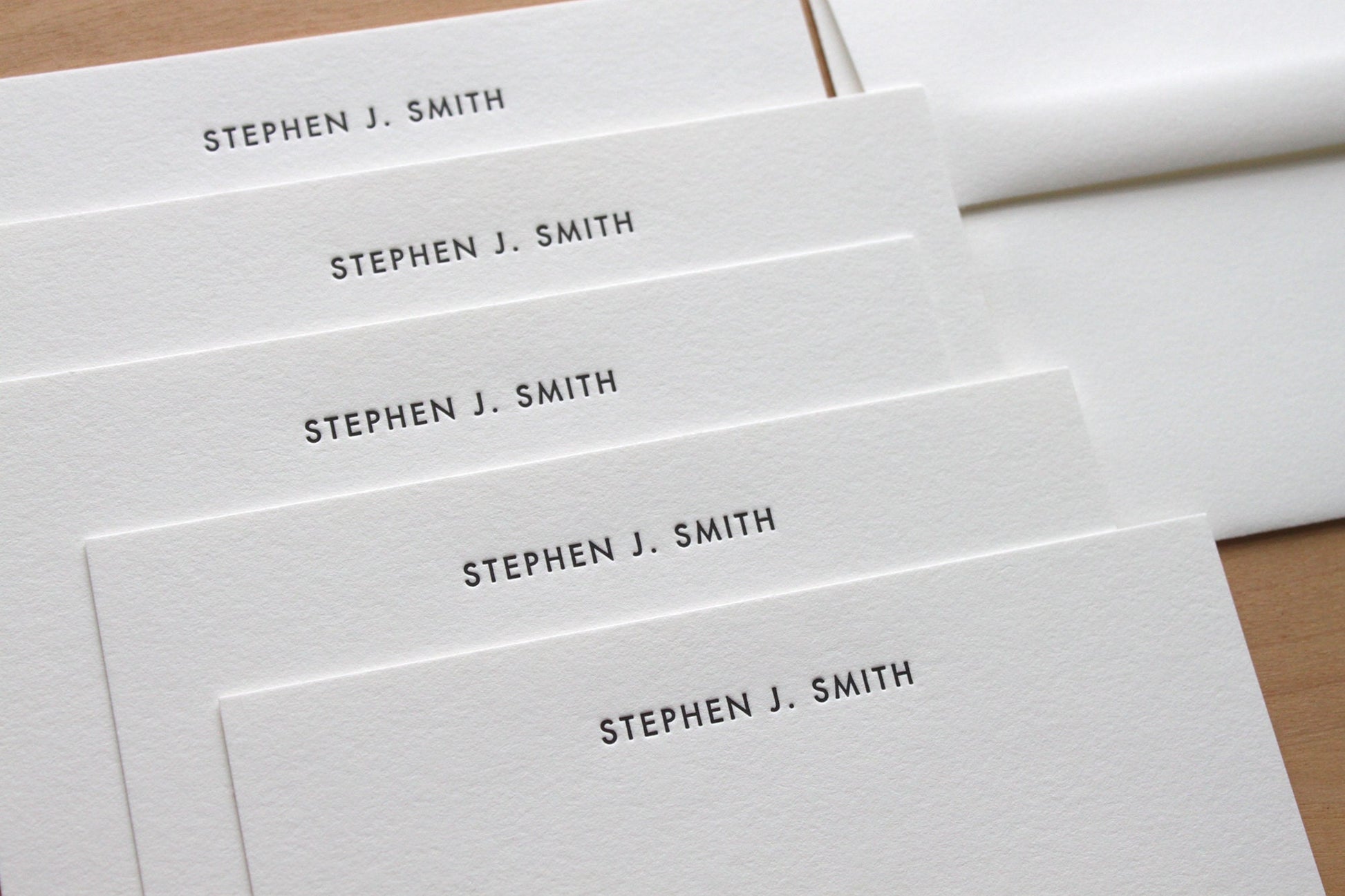Close up of Futura letterpress notecard showing deep impression on heavyweight cotton paper
