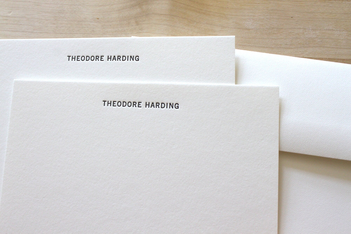 Clean sans serif type letterpress stationery impression on premium cotton notecard for professionals